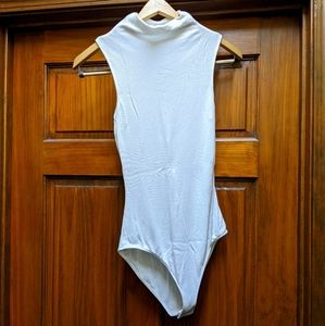 Two Summersalt sleeveless mock neck bodysuits